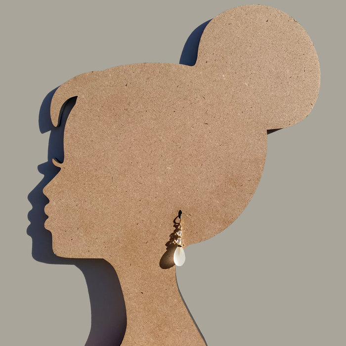 Frosted white earrings with gold trim from Owen Glass Collection, showcasing elegant round design and shiny finish.