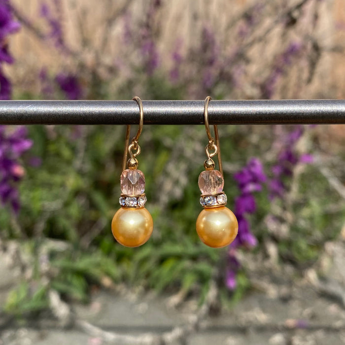 Gold crystal pearl drop earrings with peach Czech glass and rhinestone accents from Owen Glass Collection, featuring elegant bell-shaped design.