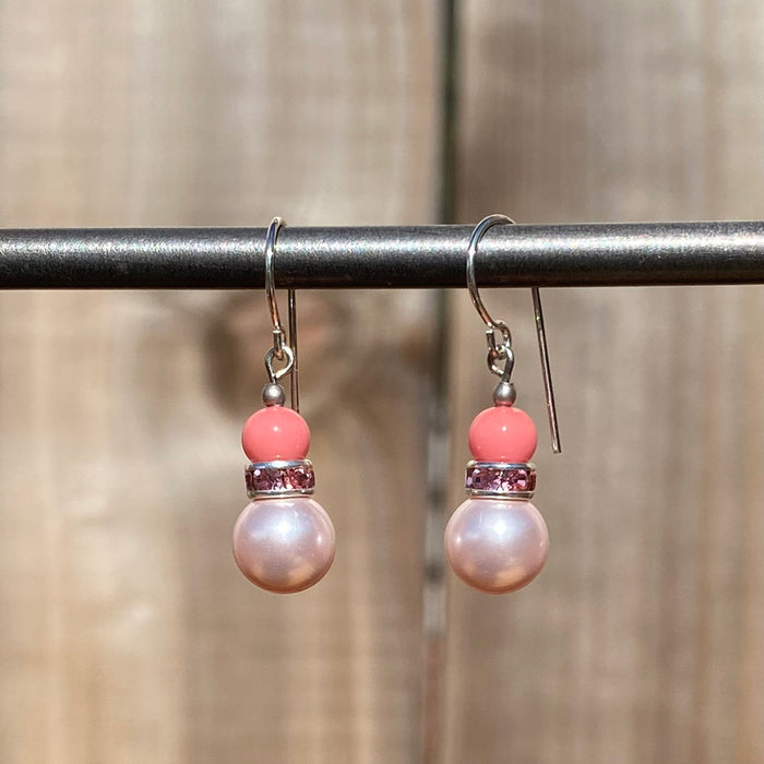 Pale pink crystal pearl earrings with rhinestone accents from Owen Glass Collection, featuring 48-inch bell-shaped design.